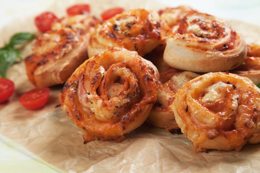 a close up of a plate of food with pizza rolls